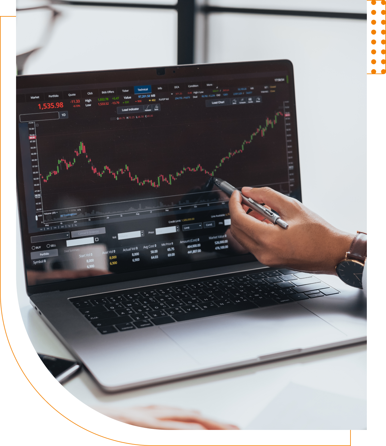 A person is looking at the stock chart on their laptop.