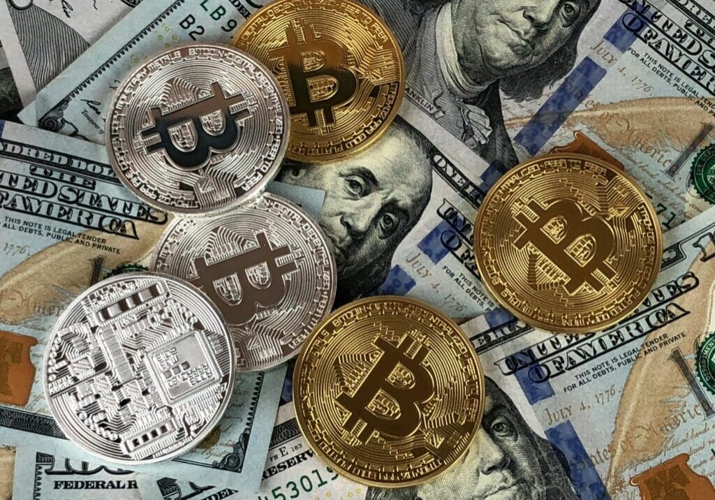 Cryptocurrency coins and US dollar bills