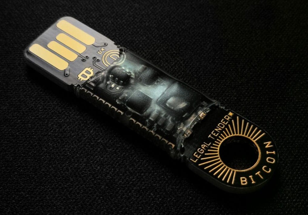 Bitcoin USB hardware wallet on black background