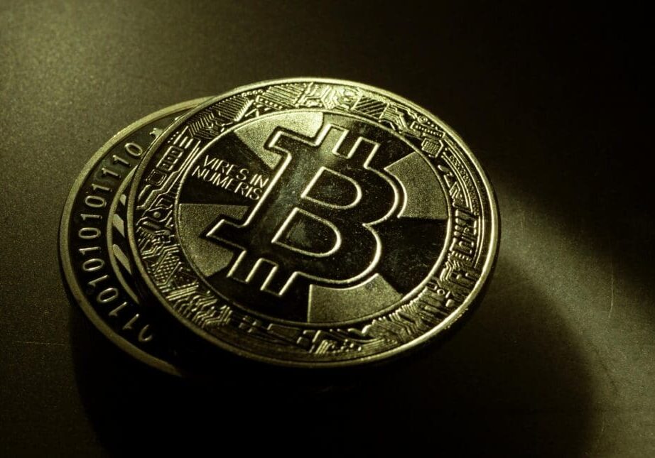 Bitcoin coin in low-light setting