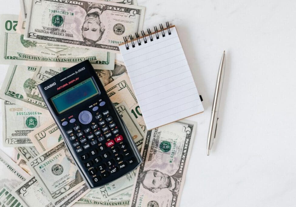 cash-counting-with-calculator-scaled