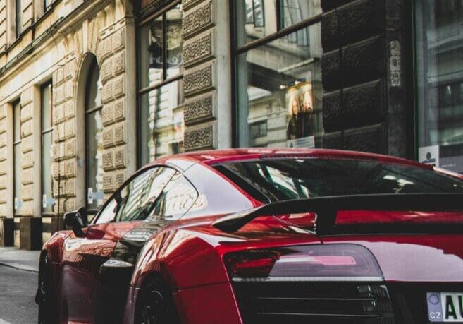 Red sports car on city street