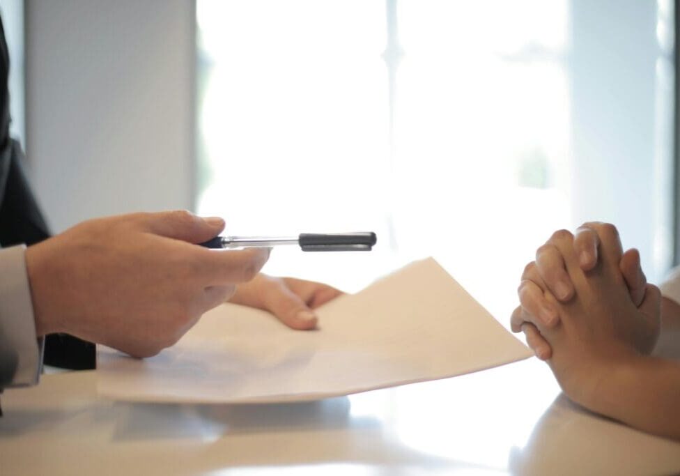 signing-contract-closeup-scaled