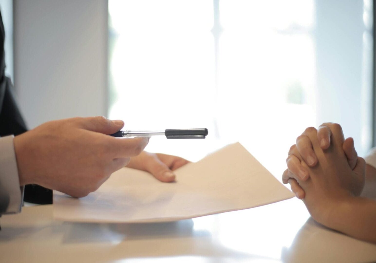 signing-contract-closeup-scaled